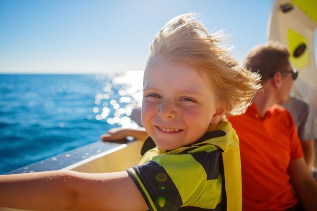 boy on boat compressor